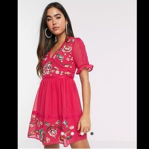 Embroidered mini dress with lace trims in hot pink